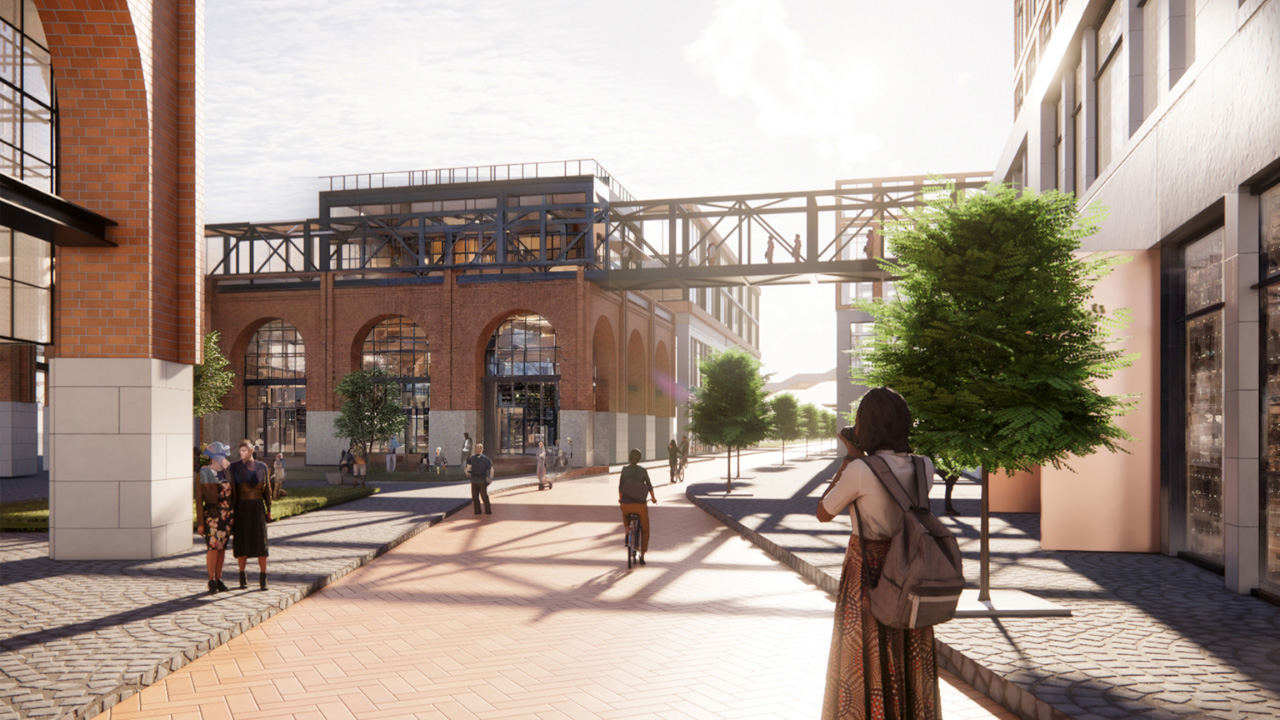 Vignette of Anchor project shows a young woman standing toward the development as she takes a photo of the mix use space 